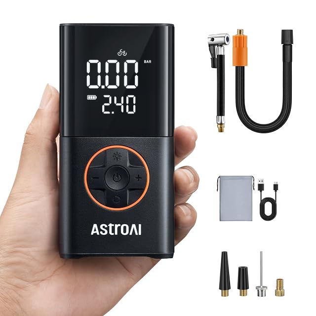 Inflador sin cable AstroAI sujeto con una mano, con la presión en pantalla
